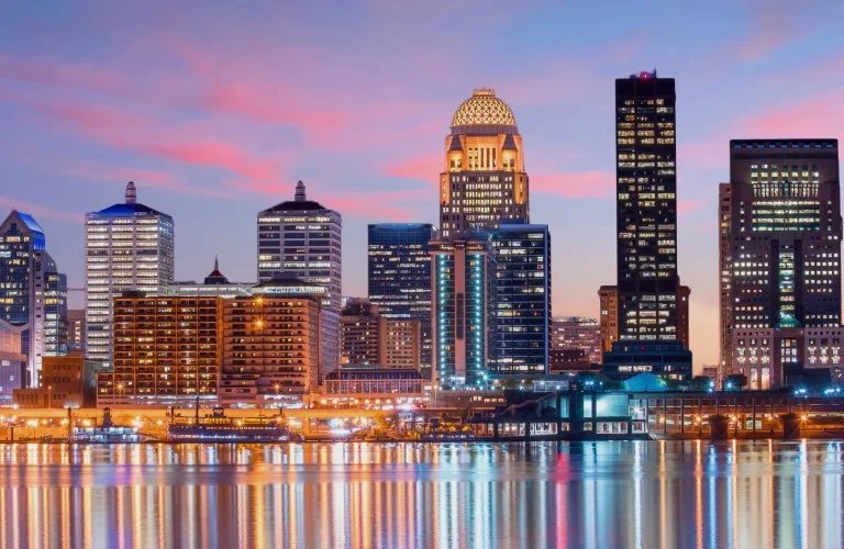 A view of a city buildings at the sunset